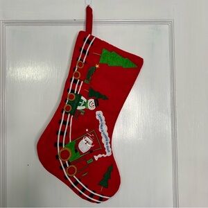Santa Claus is Coming to Town 
Red Christmas Stocking with Santa and Snowman.